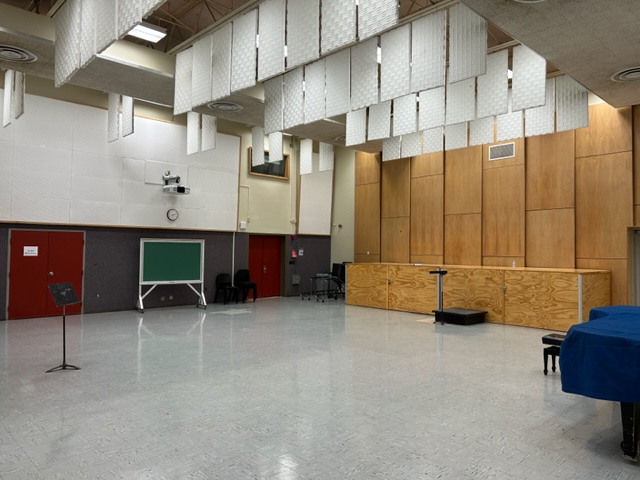 Large classroom with a blackboard.