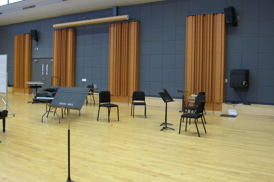Classroom with chairs and sheet music stands.