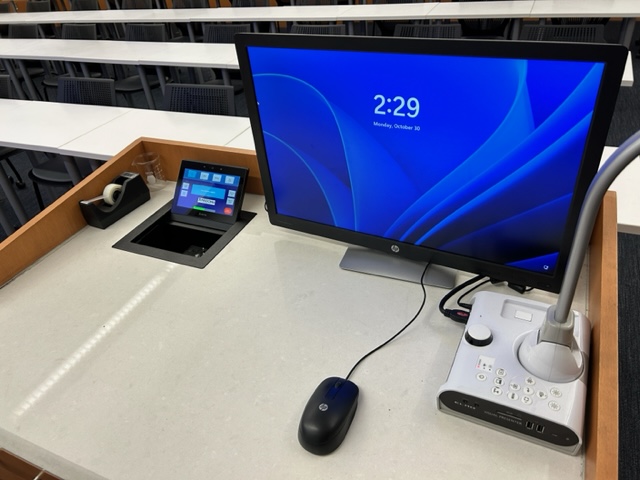 Teachers computer station with an Extron touch panel switcher.