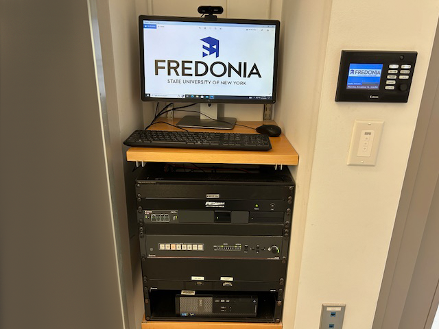 Teachers computer station with an Extron switcher rack