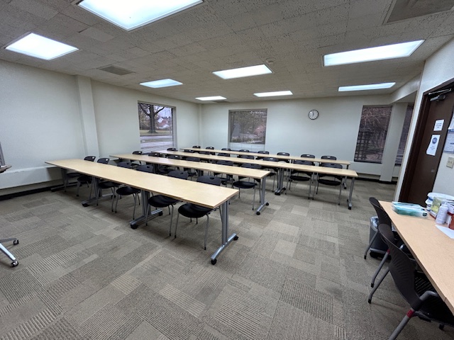 Back of the classroom with student seats arranged in rows.