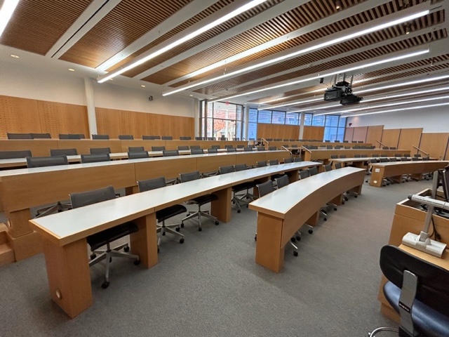 Back of the classroom with student desks arranged in rows.