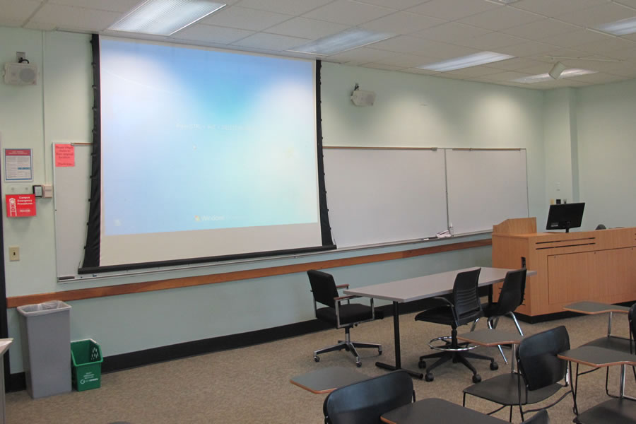 Fenton 170 front of classroom with a big whiteboard and projector screen.