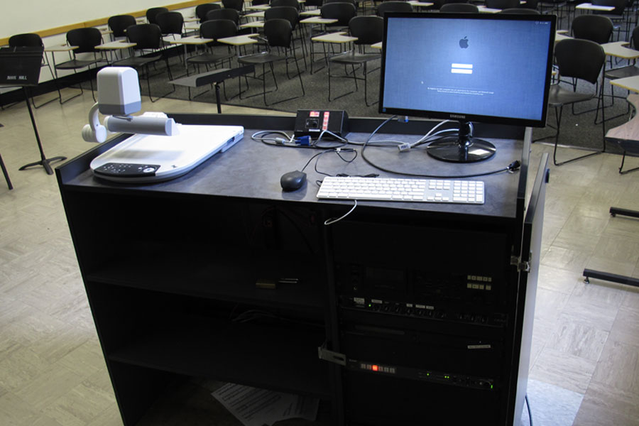 Mason 2019 Smart Classroom teachers station with a computer and projector controller.