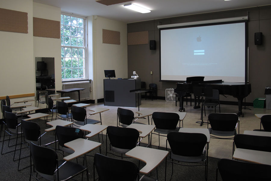 Mason 2019 Smart Classroom front of the classroom with a large projector screen.