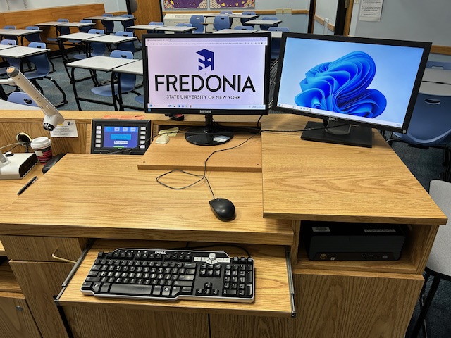 Accessible teachers station with a computer and Extron touchpanel.
