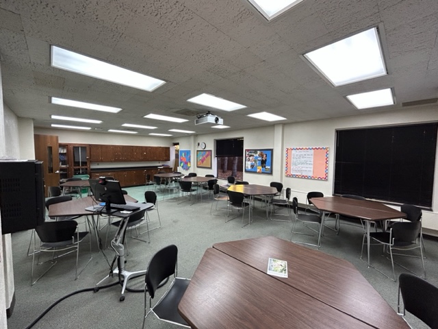 Back view of the classroom with student desks.