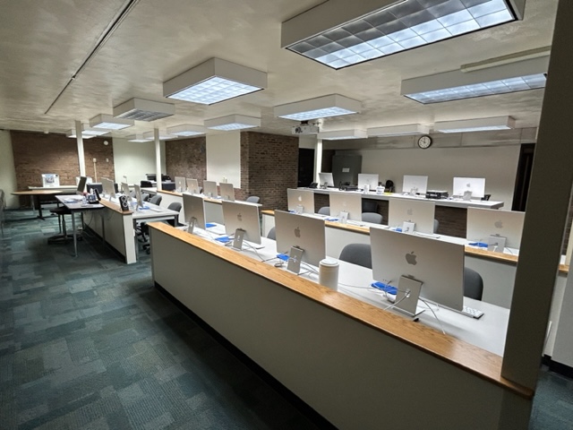 Back of the classrooms with student computer desks