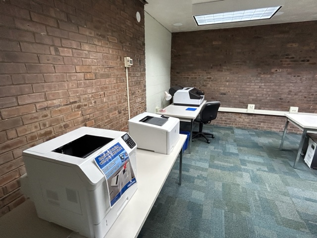 Classroom printers set on tables.