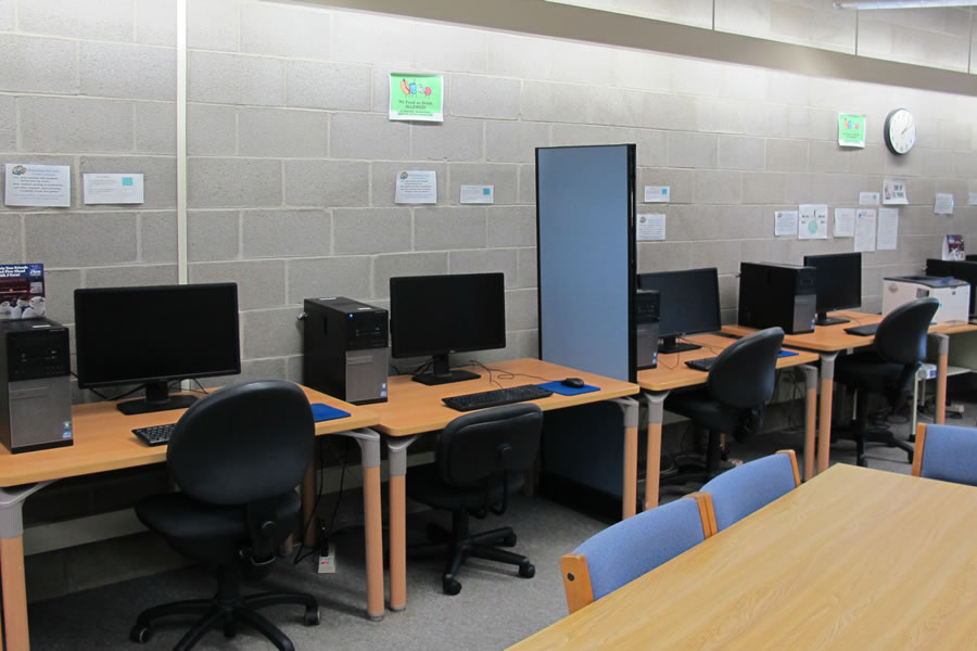 Learning Center Computer Lab with a row of computer desks.