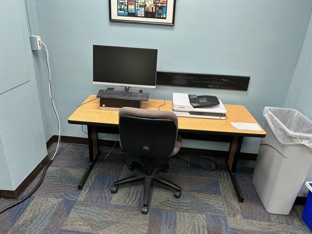 Main computer desk with a scanner.