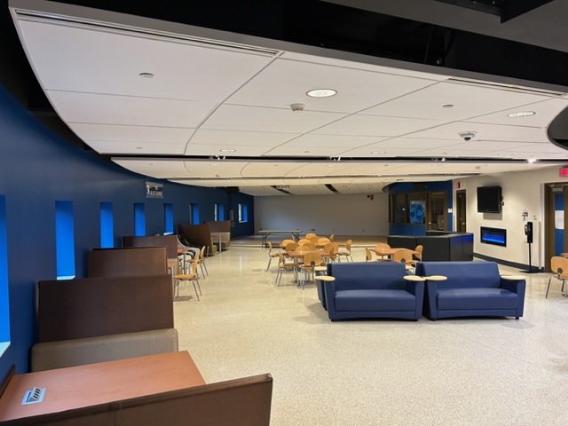 Front of the lounge with tables and chairs.