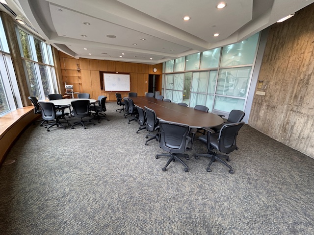 Front of the conference room with a large white board.